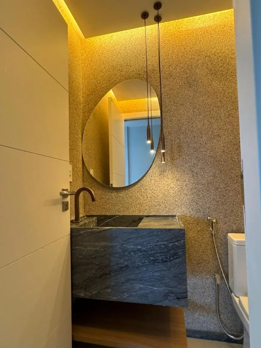 Lavabo com cuba esculpida em pedra natural pela BM Rochas